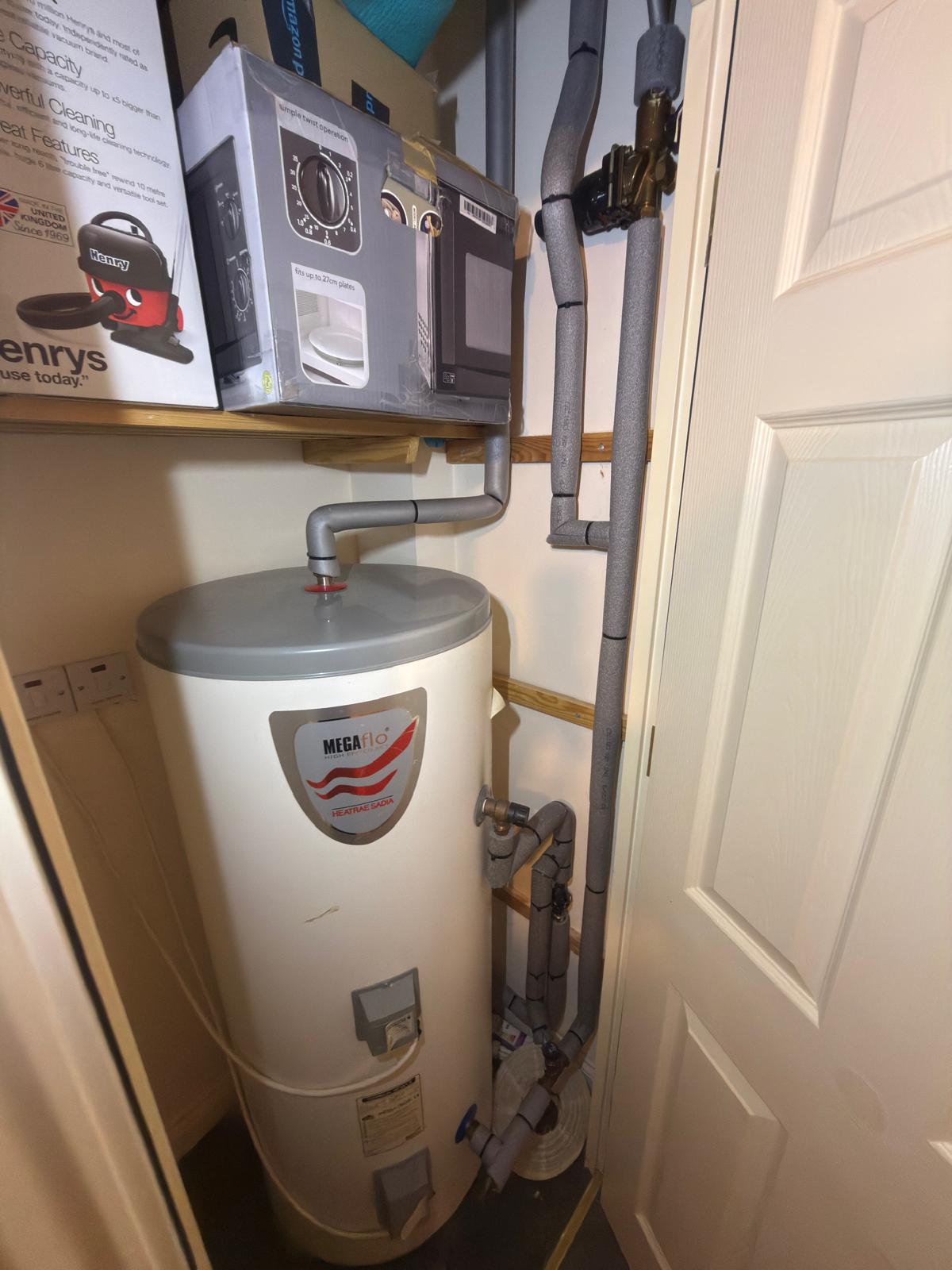 A boiler or hot water cylinder installed by G V Hall Ltd