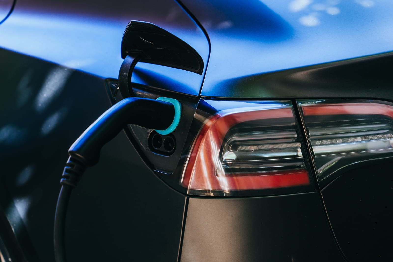 An electric car plugged in and charging