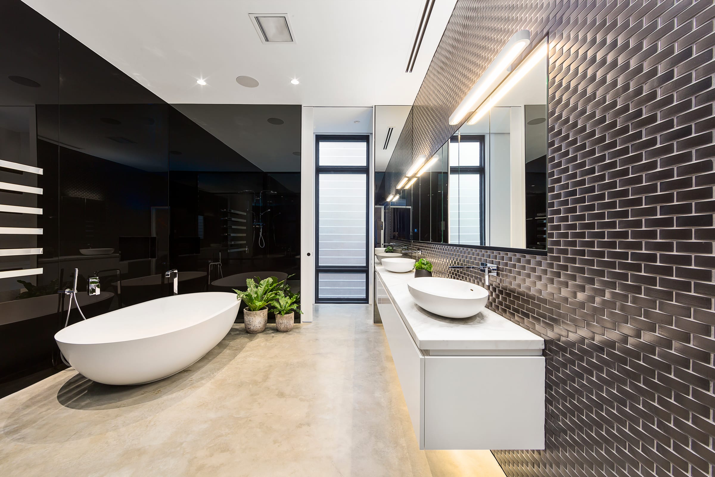 A minimalist bathroom with a freestanding bath